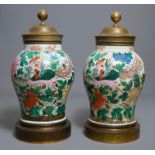 A pair of large Chinese famille rose brass mounted 'phoenix' vases, 19th C.