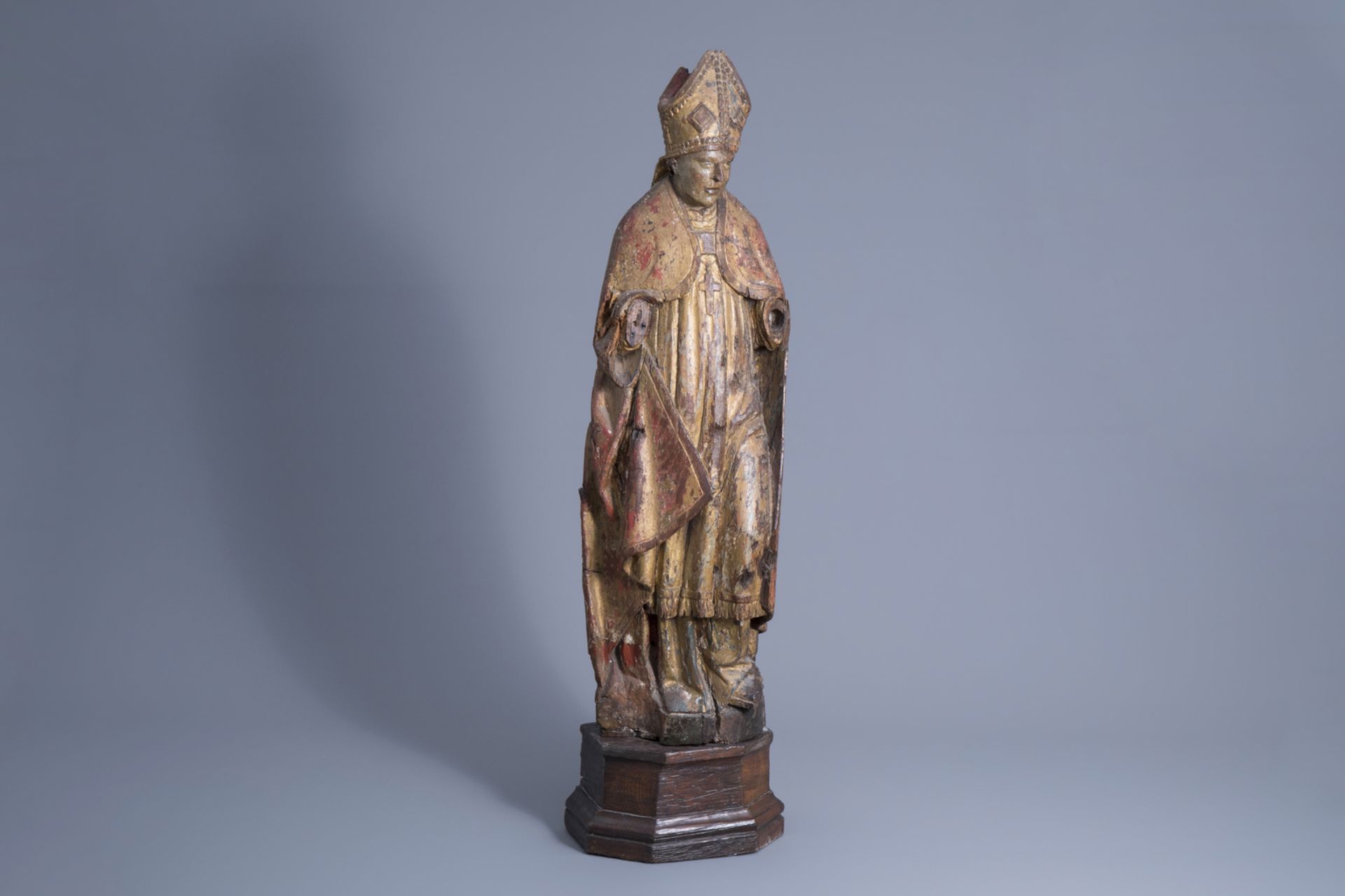 A carved, polychrome painted and gilt wooden figure of a bishop, Southern Netherlands, Flanders, 16t