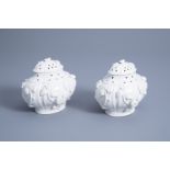 A pair of French soft paste Mennecy porcelain pot-pourri vases and covers with floral relief design,