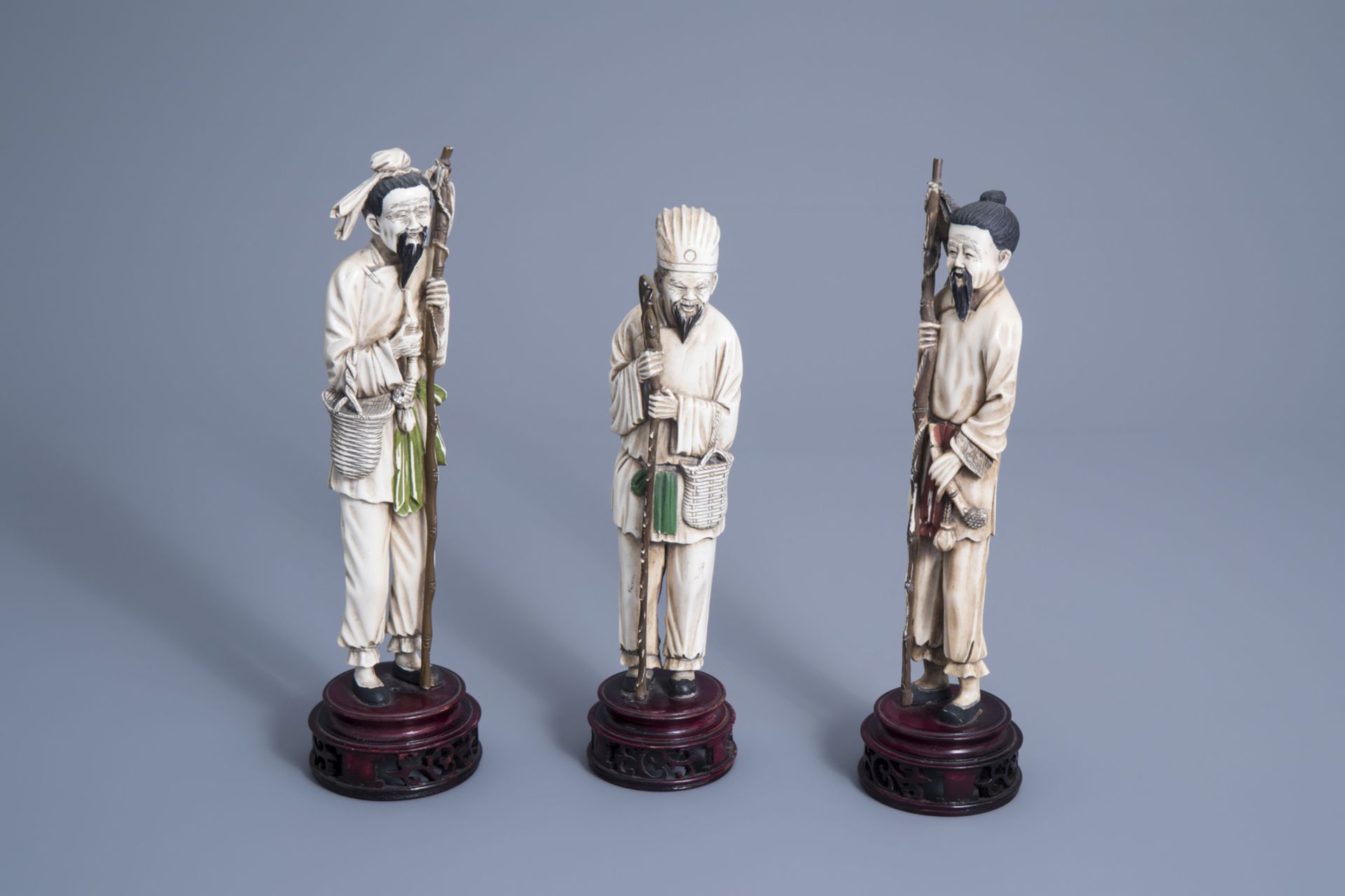 Three Chinese carved ivory figures of fishermen, 19th/20th C.
