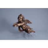 A patinated carved wooden figure of a putto, Southern Netherlands, 18th C.