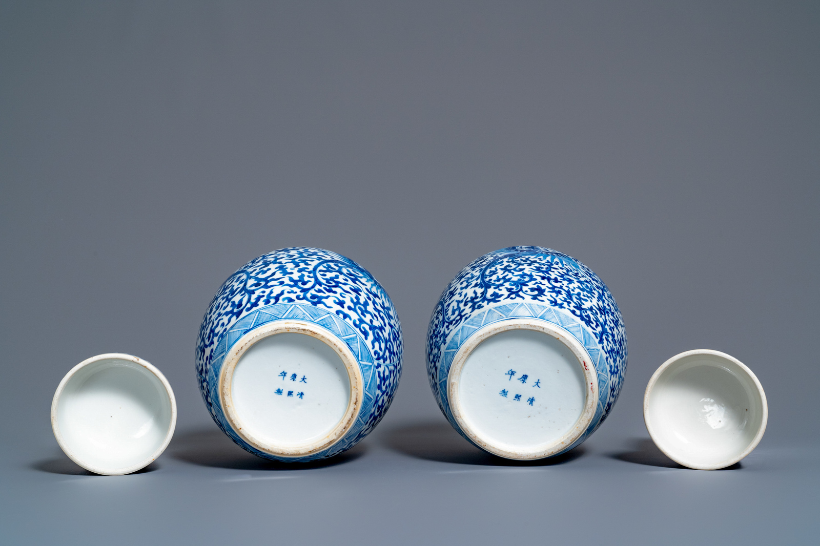 A pair of Chinese blue and white 'phoenix' jars and covers with floral design, Kangxi mark, 19th C. - Image 7 of 7