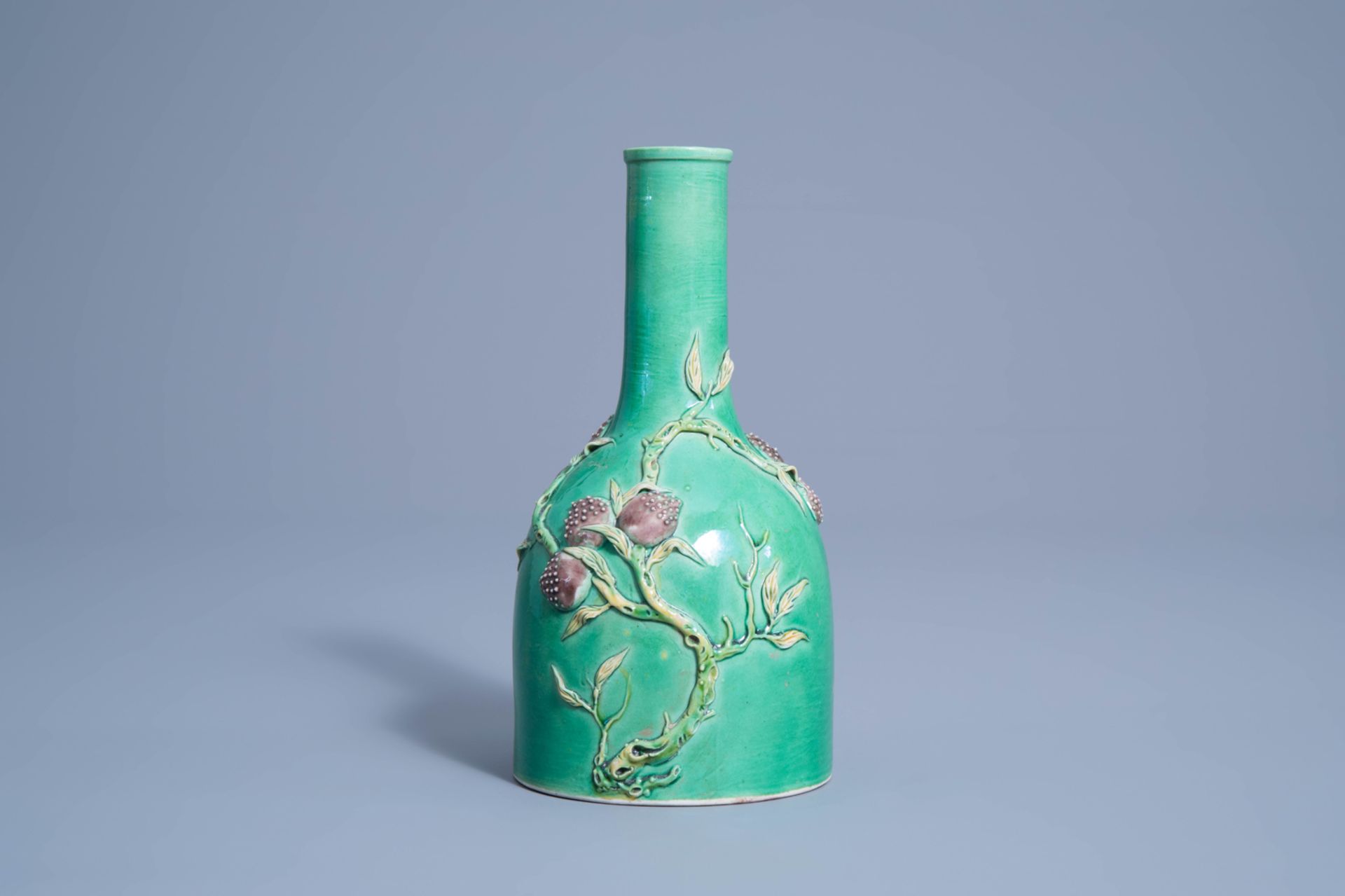 A Chinese verte biscuit vase with relief design of nine peaches, 19th/20th C. - Image 2 of 7