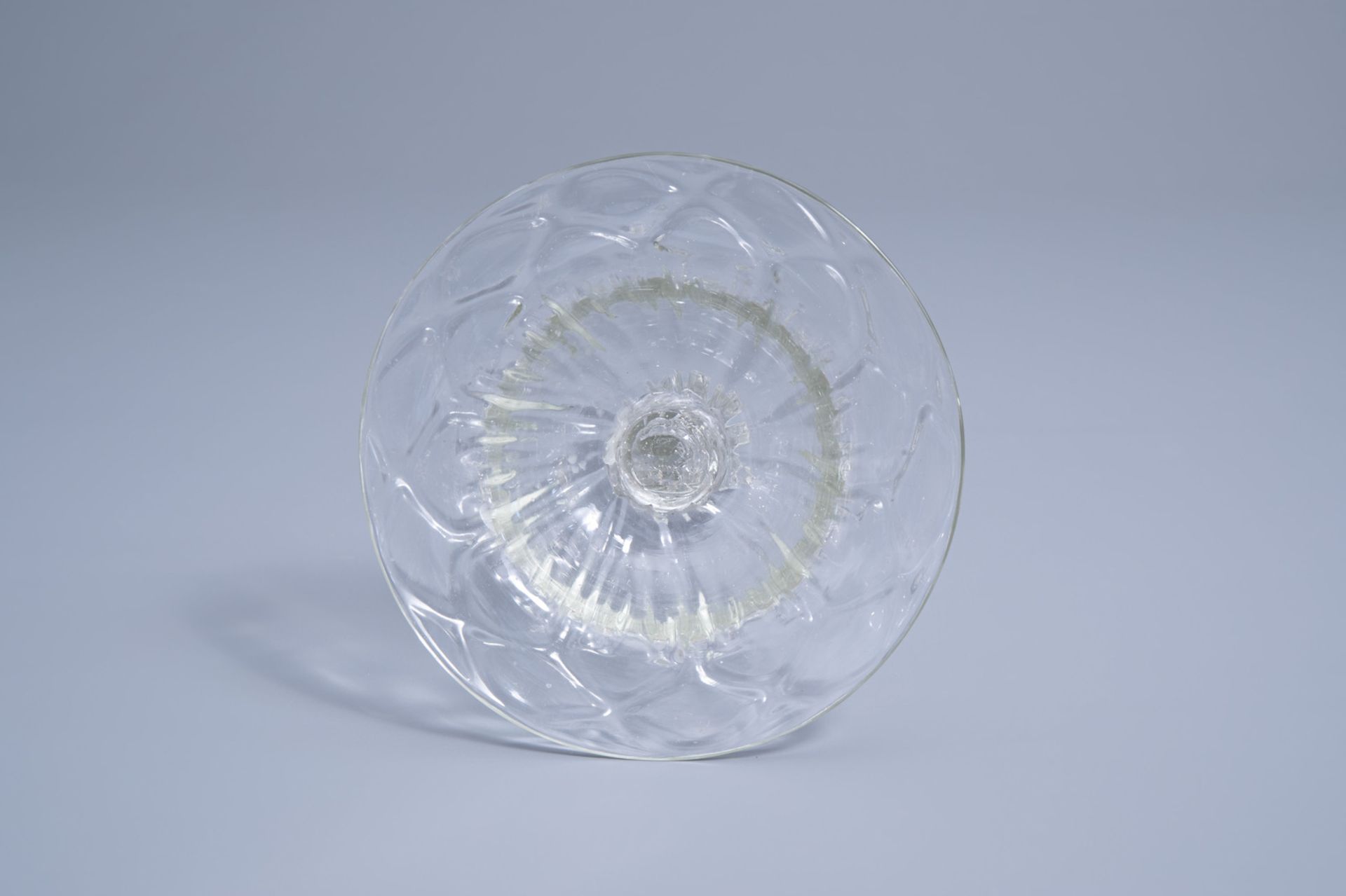 A mouth-blown glass candlestick with a moulded eight-sided pedestal stem, possibly Lige, 18th C. - Image 7 of 7