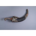 A large Tibetan silver dagger with coral and turquoise inlay, 19th/20th C.