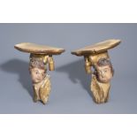 A pair of German polychrome painted and gilt wooden putti, transformed into pedestals, 18th C. and l