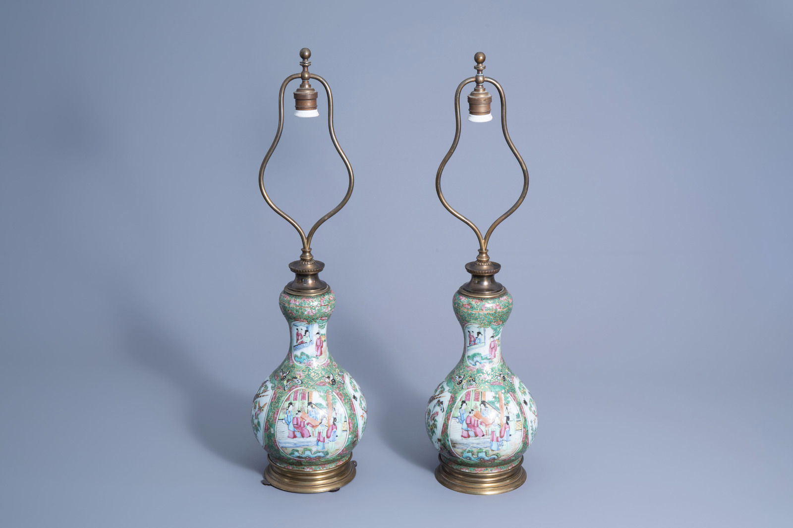 A pair of Chinese Canton famille rose double gourd vases mounted as lamps, 19th C.
