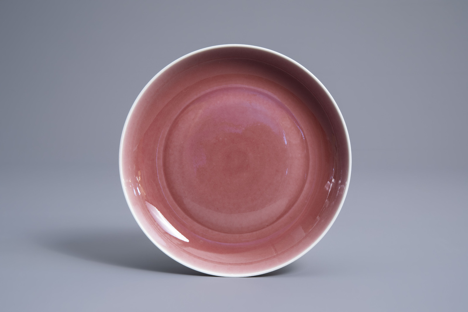 A Chinese monochrome liver red saucer dish, Xuande mark, 19th/20th C.