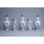 A Dutch Delft blue and white five-piece vase garniture with floral design, 18th C.