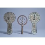 A pair of Thai bronze hand mirrors and a crown ornament for a shrine, 19th/20th C.