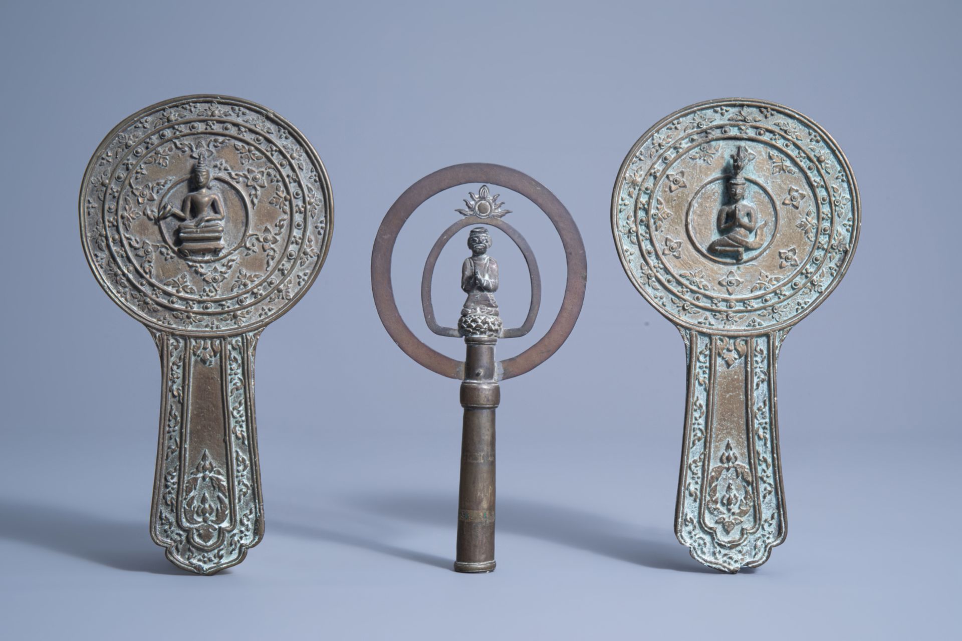 A pair of Thai bronze hand mirrors and a crown ornament for a shrine, 19th/20th C.