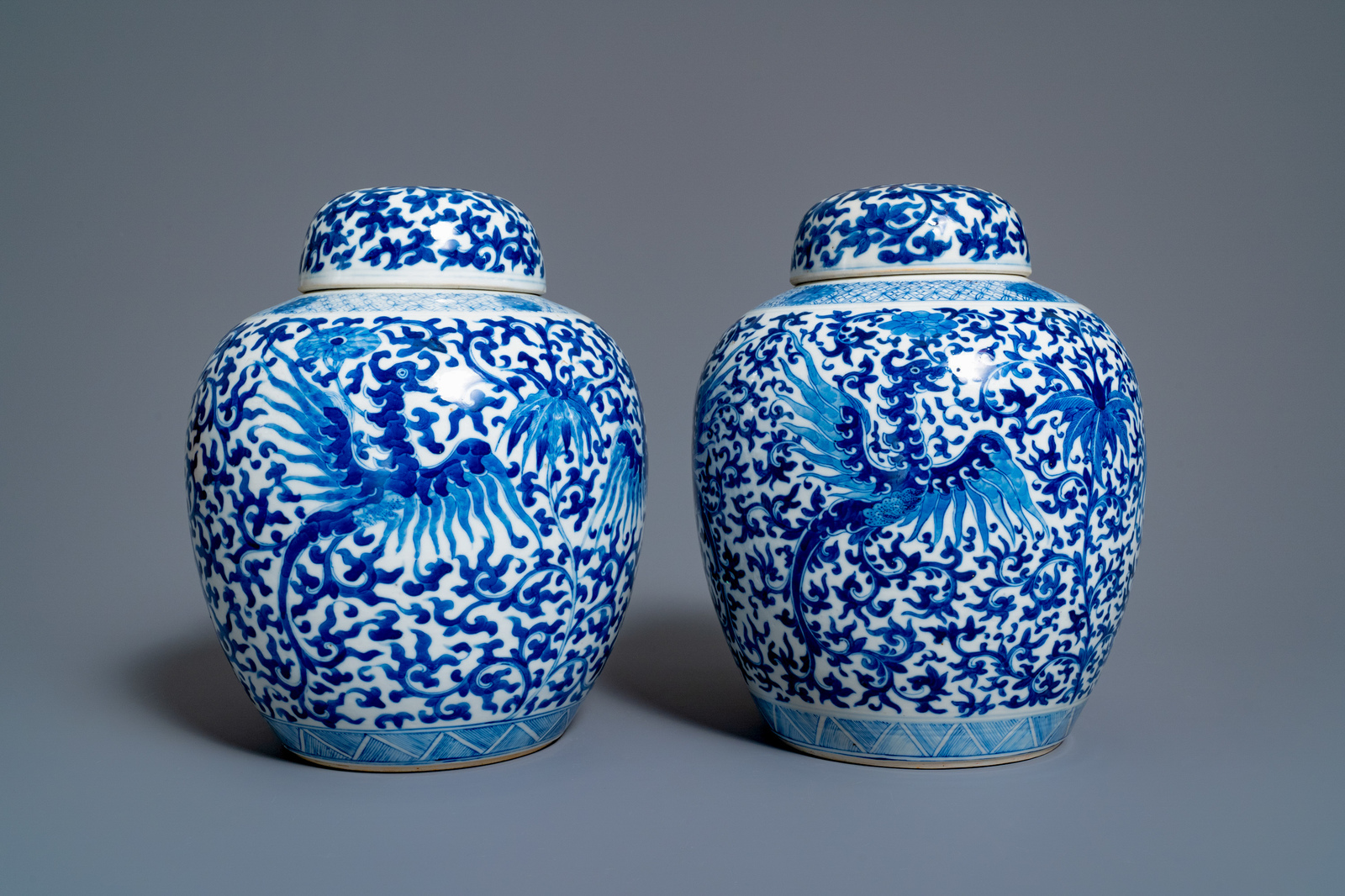 A pair of Chinese blue and white 'phoenix' jars and covers with floral design, Kangxi mark, 19th C. - Image 2 of 7