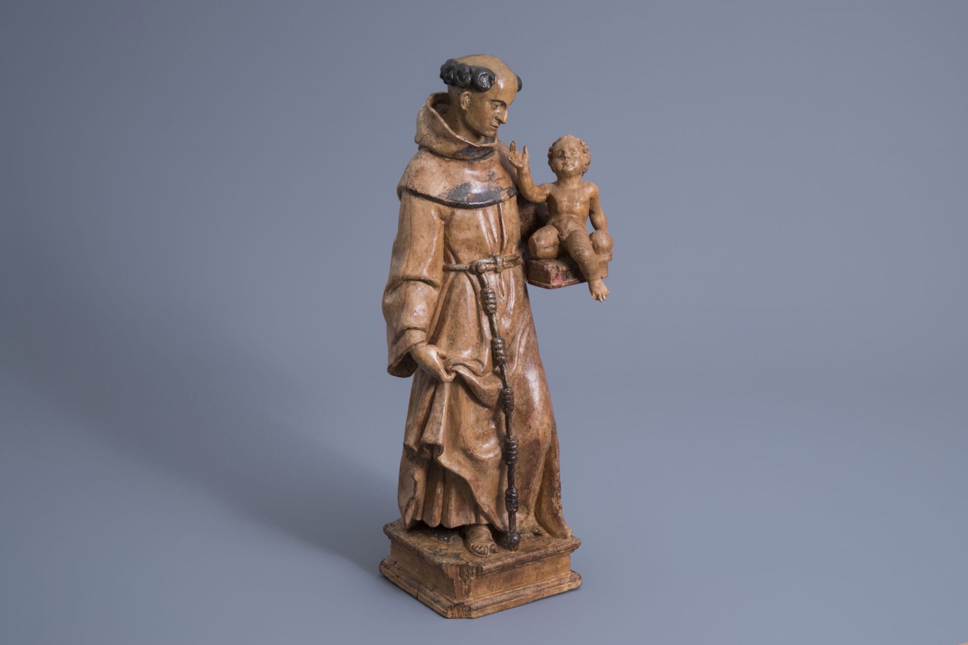 A carved wooden figure of Saint Anthony of Padua with Child, the Netherlands, 16th C.