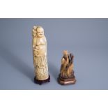 A Chinese ivory figure of a Buddha with children and one of an Immortal, early 20th C.
