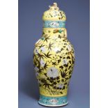 A large Chinese famille rose vase and cover with dragons on a yellow ground, 19th C.