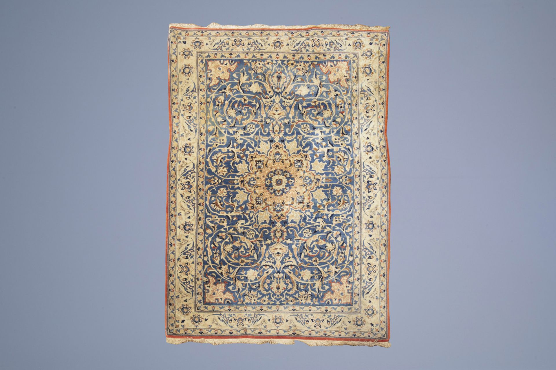 An Oriental rug with floral design, silk on cotton, 20th C.