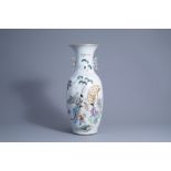 A Chinese famille rose vase with ladies and playing boys, 19th/20th C.