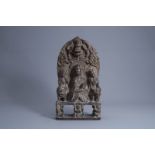 A Chinese carved stone stele depicting Buddha with two attendants, probably Ming