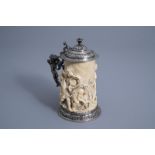 A German silver mounted ivory tankard with a triumphant procession, 17th C. or later