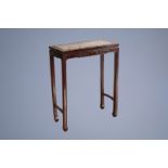 A Chinese hard wooden console table with marble top, 19th/20th C.