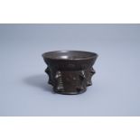 A French bronze mortar with fleur-de-lis design, 17th C.