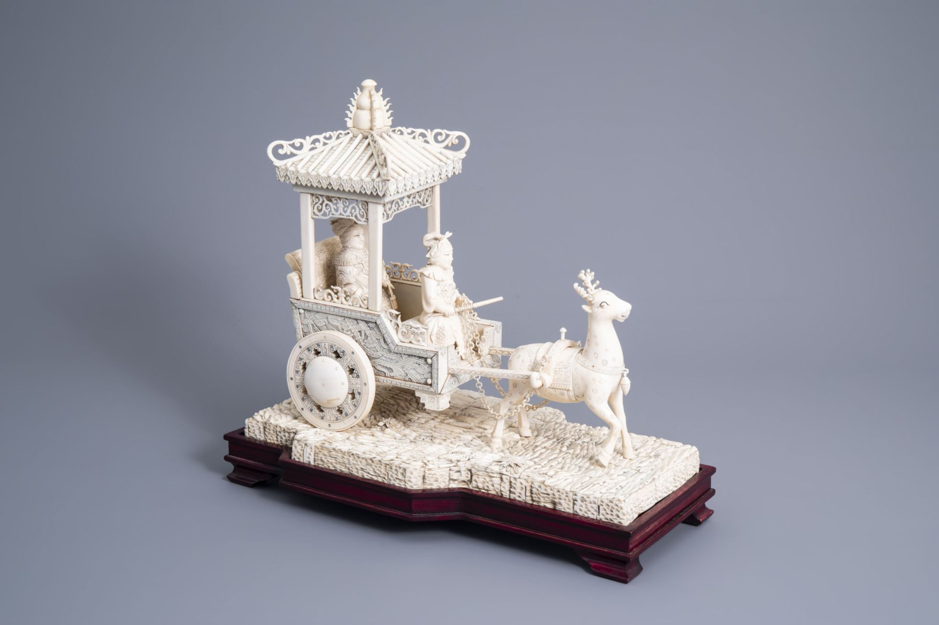 A large Chinese carved ivory 'deer carriage' group, 19th/20th C.