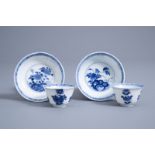 A pair of Chinese blue and white cups and saucers with floral design, Kangxi