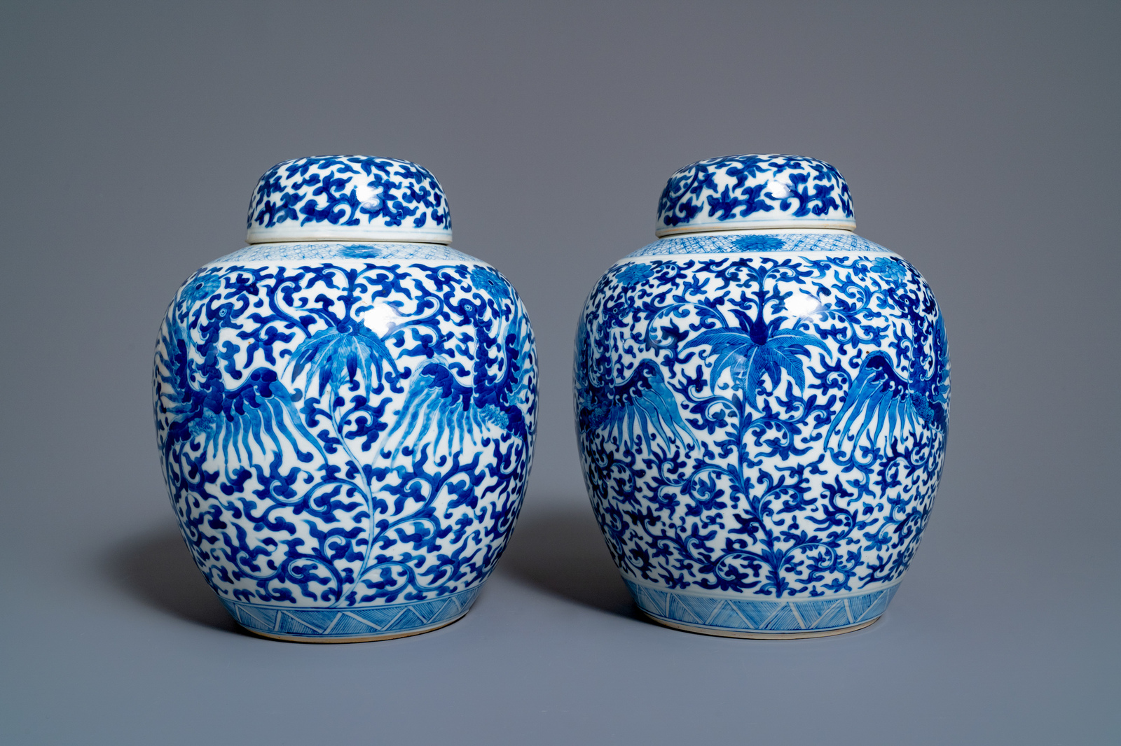 A pair of Chinese blue and white 'phoenix' jars and covers with floral design, Kangxi mark, 19th C. - Image 3 of 7