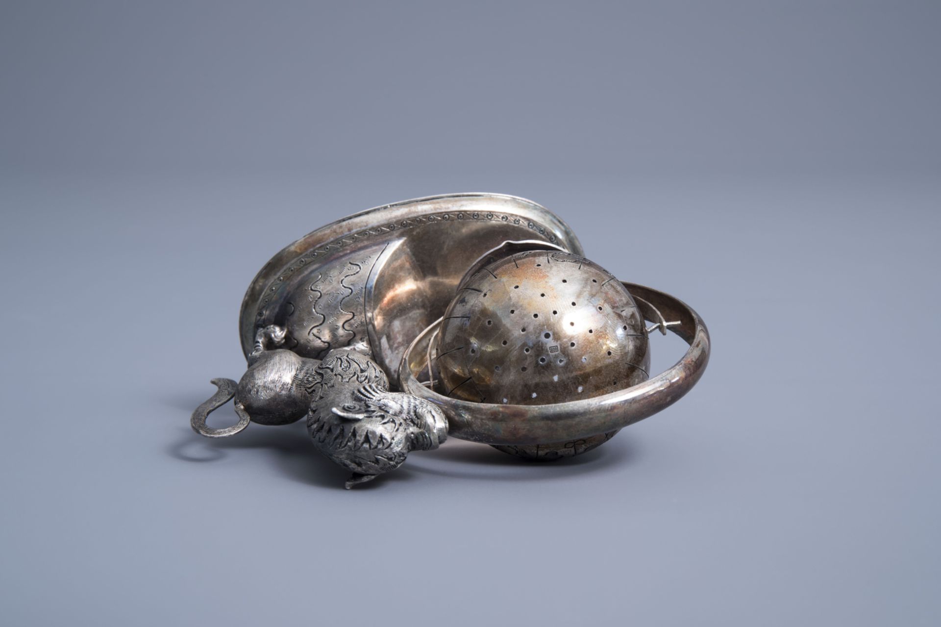 A Vietnamese silver tea strainer in the shape of a mythical animal playing with a globe, 800/000, 19 - Image 8 of 11