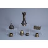 A varied collection of Islamic inlaid brass and copper ware, North Africa and Middle East, 19th/20th