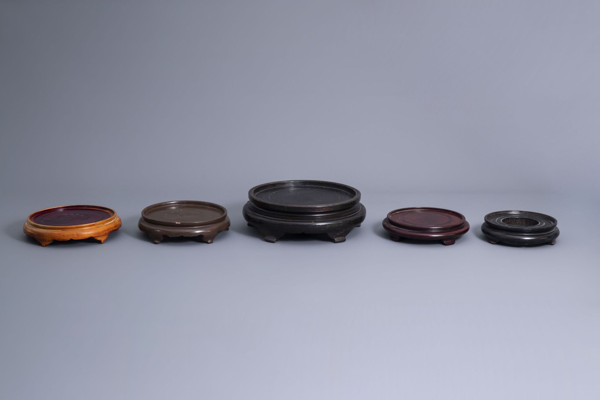 A collection of Chinese wooden stands and a collection of plate holders, 19th/20th C. - Image 2 of 19