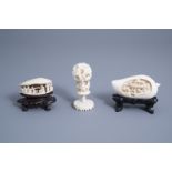 A Chinese reticulated ivory shell, a peach and a puzzle ball, first half 20th C.