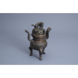 A Chinese bronze incense burner with reticulated cover, Qing