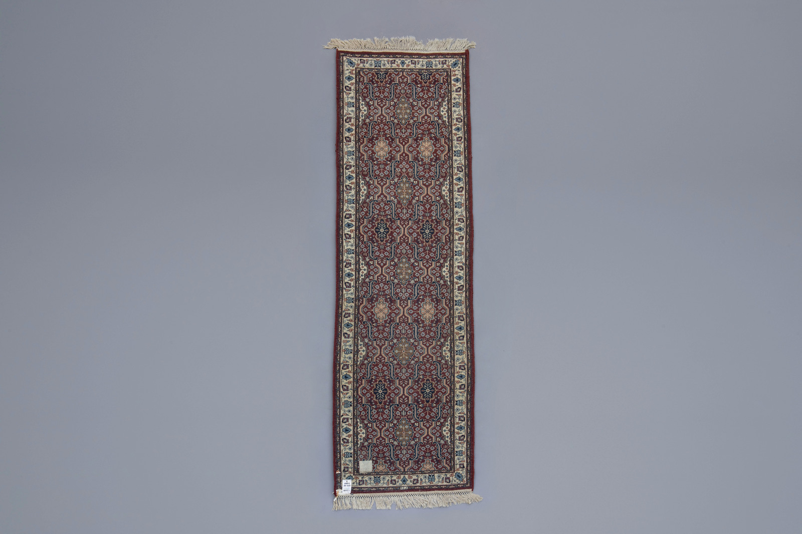 An Oriental runner with floral design, wool on cotton, 20th C. - Image 2 of 3