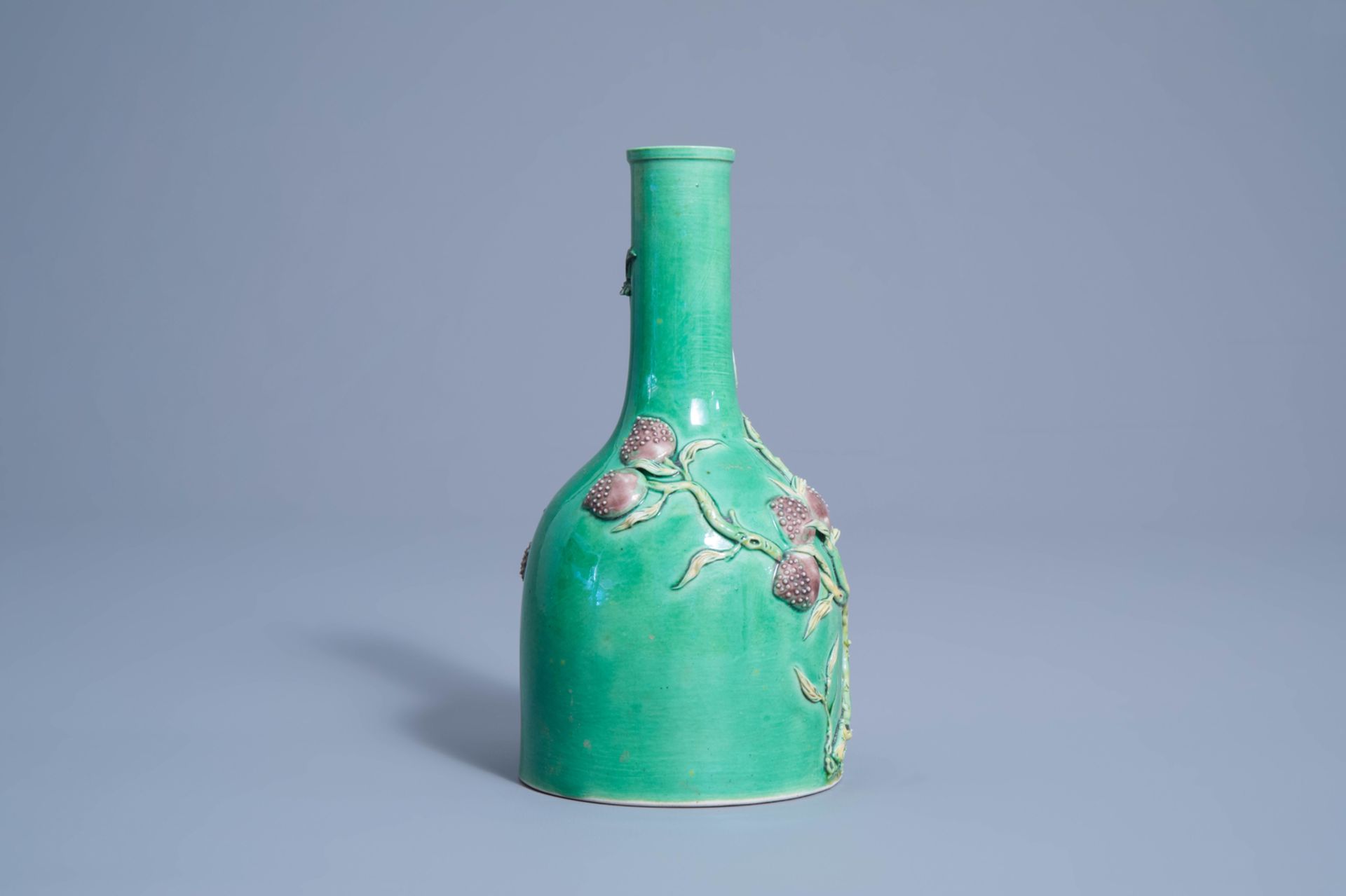 A Chinese verte biscuit vase with relief design of nine peaches, 19th/20th C. - Image 3 of 7