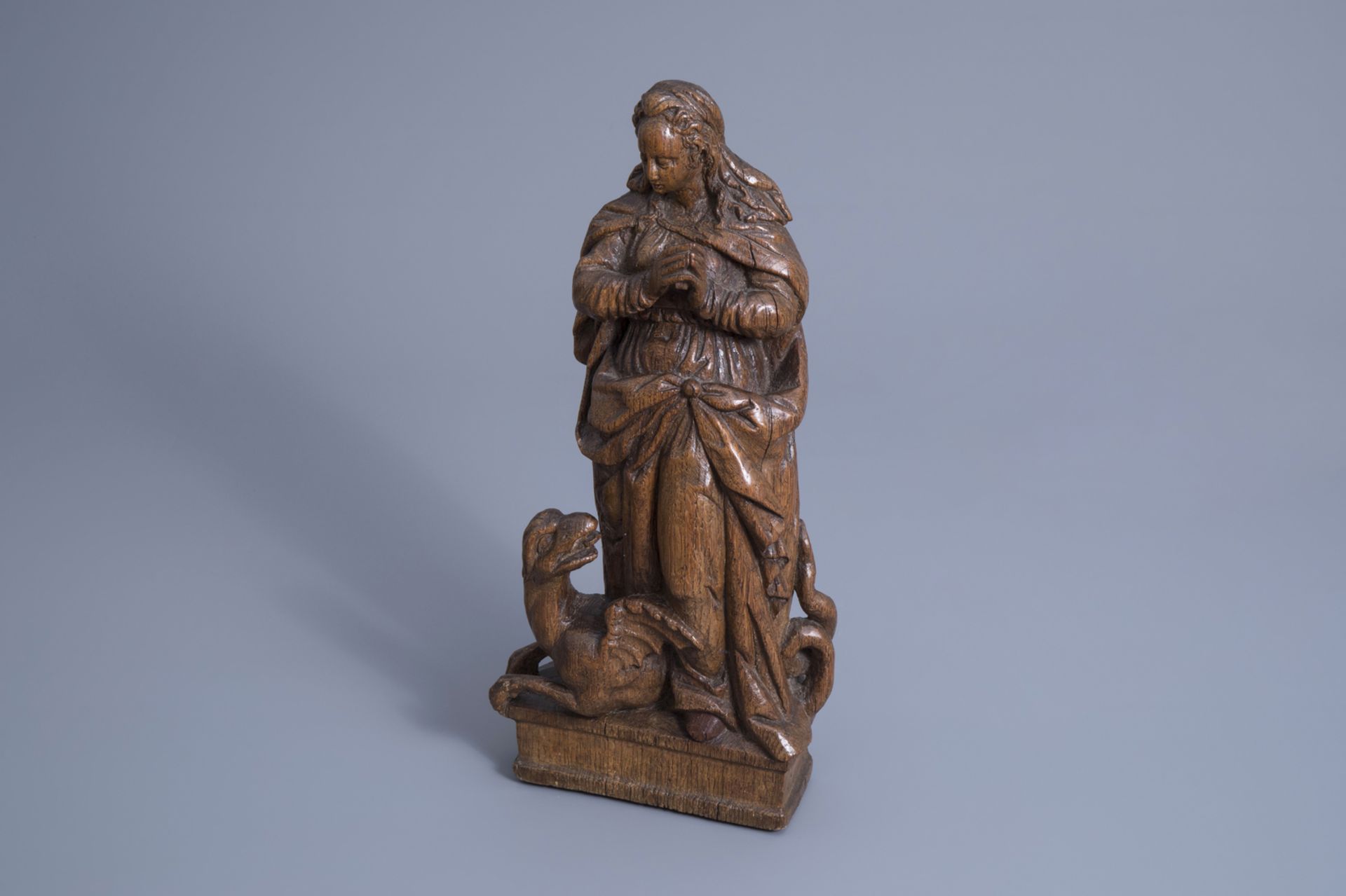 A carved oak wooden figure of Saint Marina the Great Martyr, Southern Netherlands, Flanders, 16th C.