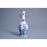 A Chinese blue and white vase with floral design and elephant head shaped handles, Kangxi