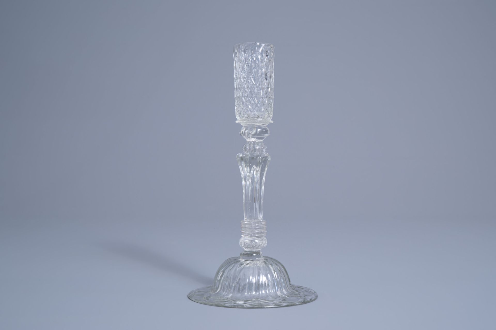 A mouth-blown glass candlestick with a moulded eight-sided pedestal stem, possibly Lige, 18th C. - Image 3 of 7