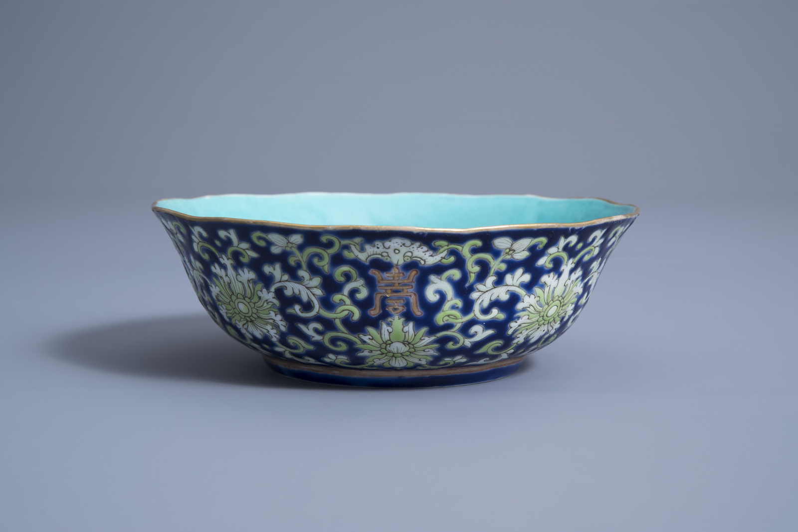 A Chinese blue ground lobed bowl with floral design, Daoguang mark and of the period