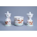 A pair of Chinese famille rose 'dragons and phoenix' candlesticks and a brush pot, first half of the