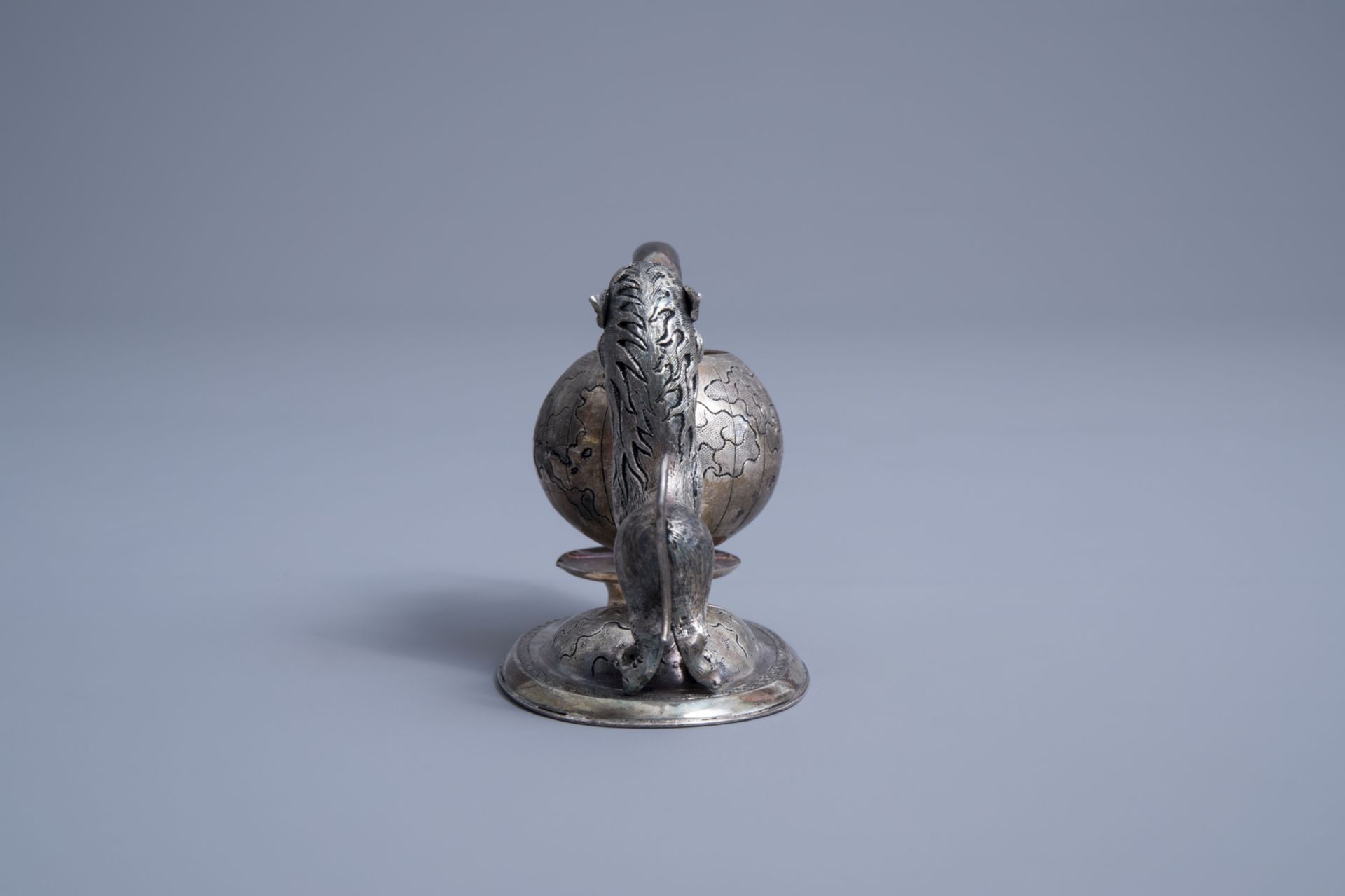 A Vietnamese silver tea strainer in the shape of a mythical animal playing with a globe, 800/000, 19 - Image 4 of 11