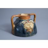 A Flemish polychrome pottery 'mascarons' jug, Torhout, first half of the 20th C.