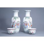 A pair of Chinese famille rose vases with ladies in a garden and a pair of jardinires with floral d