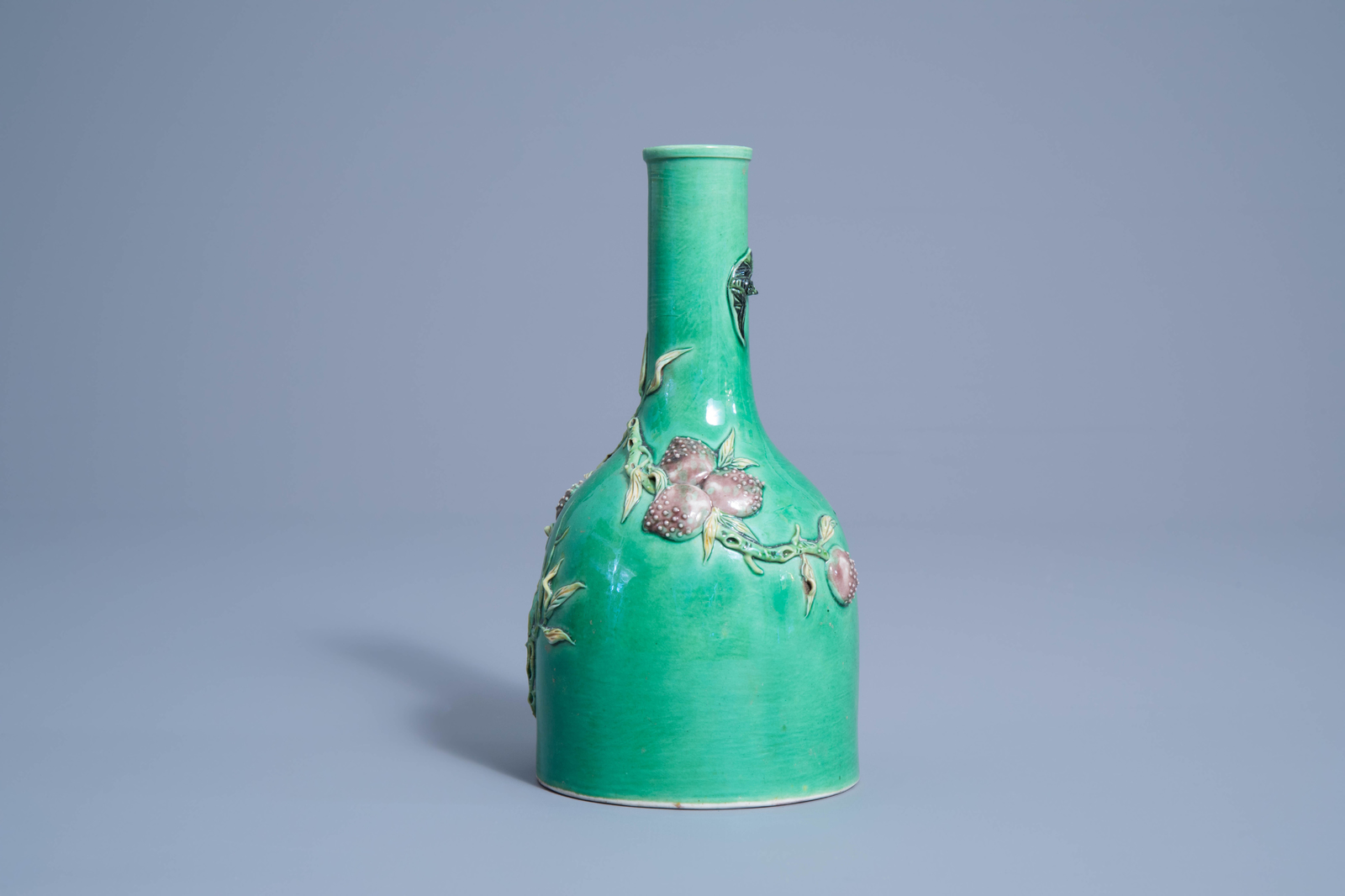 A Chinese verte biscuit vase with relief design of nine peaches, 19th/20th C. - Image 5 of 7