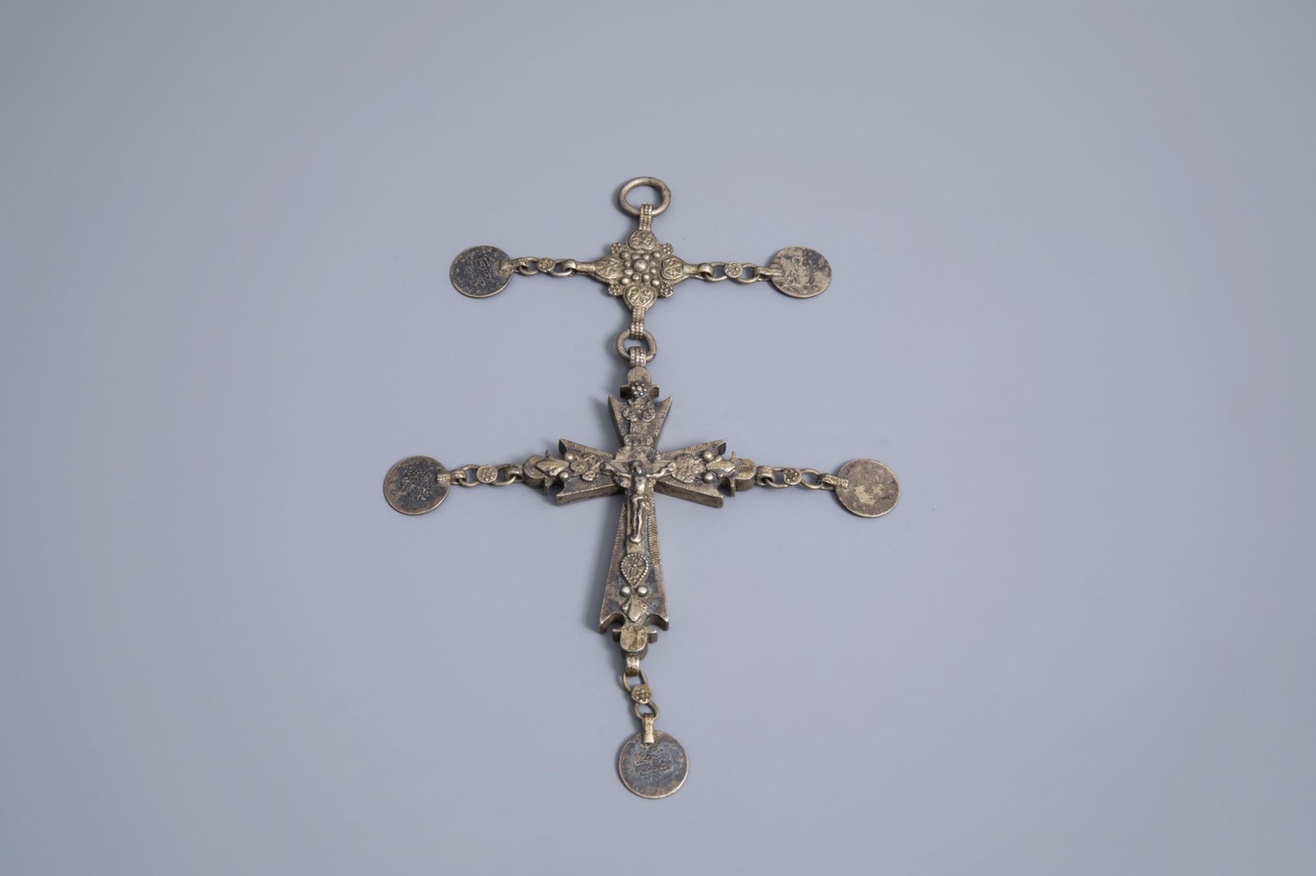 A varied collection of partly silver religious necklaces and crosses, various origins, 19th/20th C. - Image 5 of 12