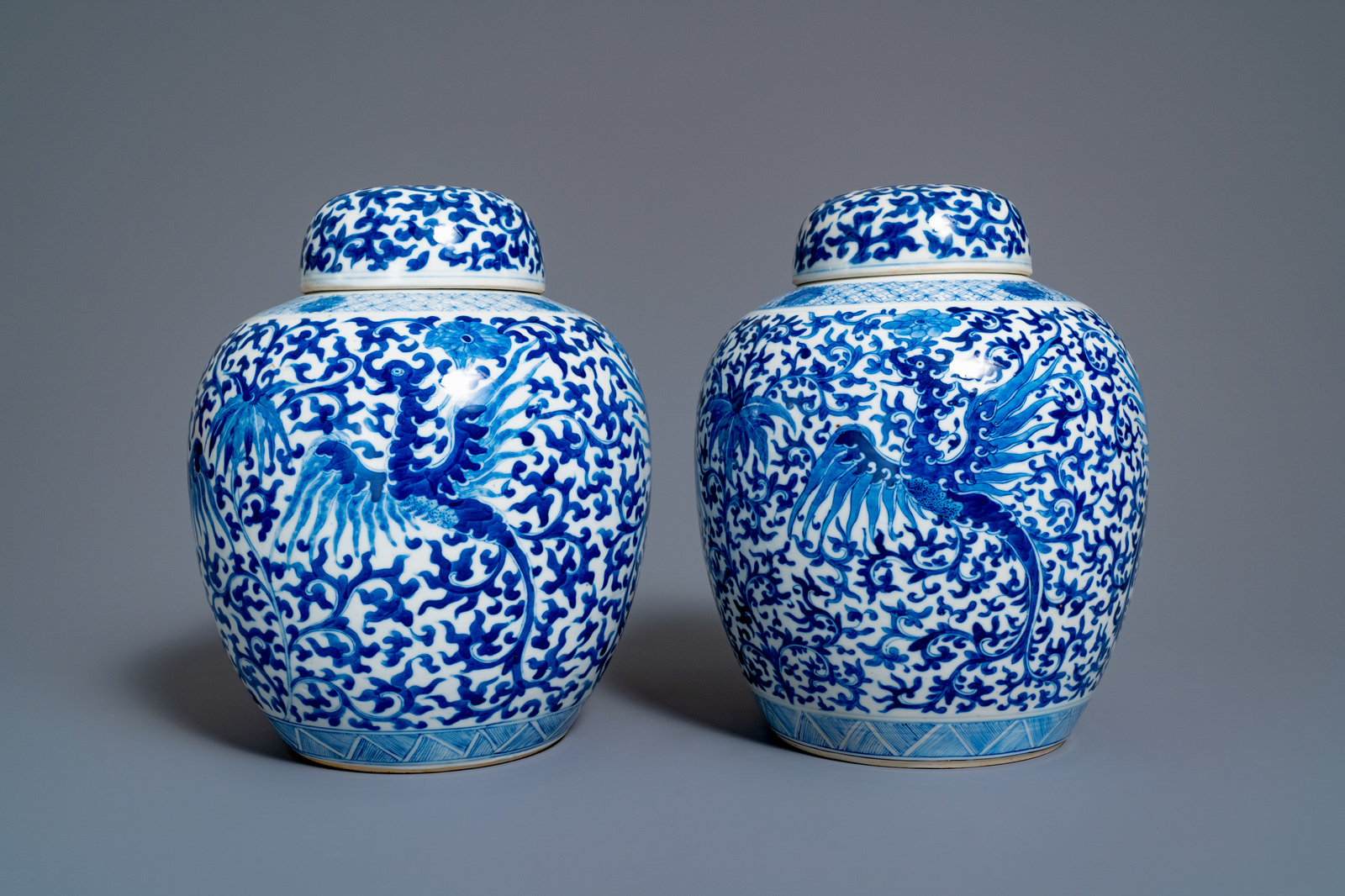 A pair of Chinese blue and white 'phoenix' jars and covers with floral design, Kangxi mark, 19th C. - Image 4 of 7