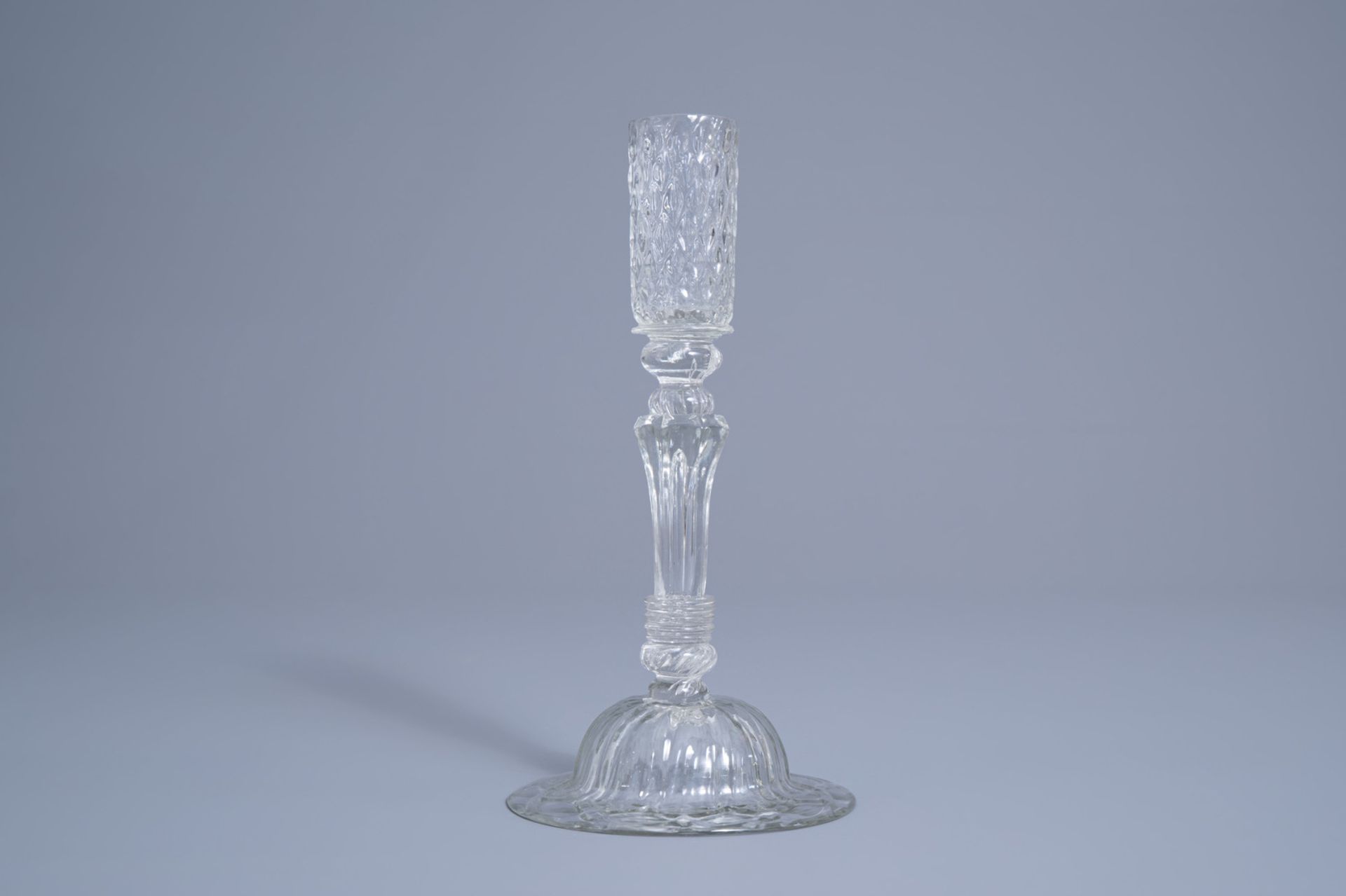 A mouth-blown glass candlestick with a moulded eight-sided pedestal stem, possibly Lige, 18th C. - Image 2 of 7