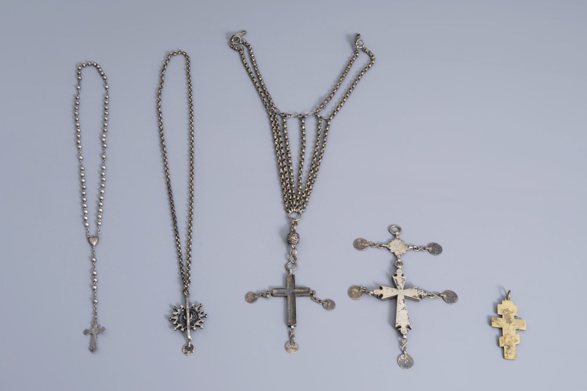 A varied collection of partly silver religious necklaces and crosses, various origins, 19th/20th C. - Image 2 of 12