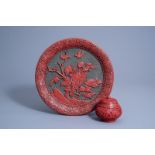 A Chinese carved cinnabar and black lacquer plate and a jar and cover with floral design, Republic,