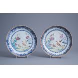 A pair of Chinese famille rose chargers with peacocks among flowering branches, Qianlong